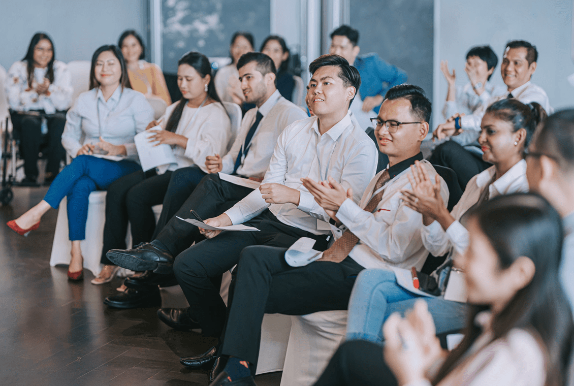 Group applauding during a conference session