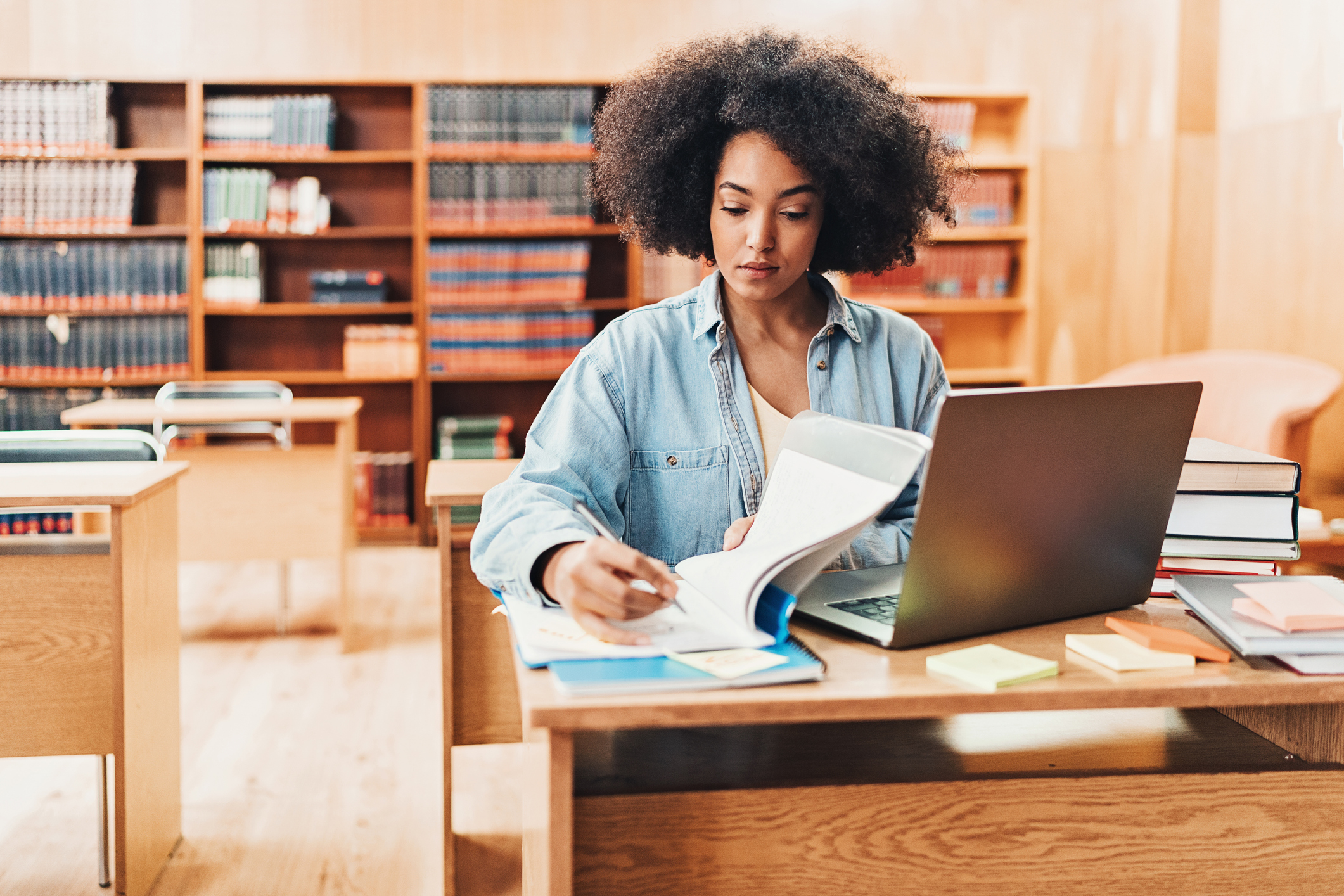 African-American ethnicity student working in a public library